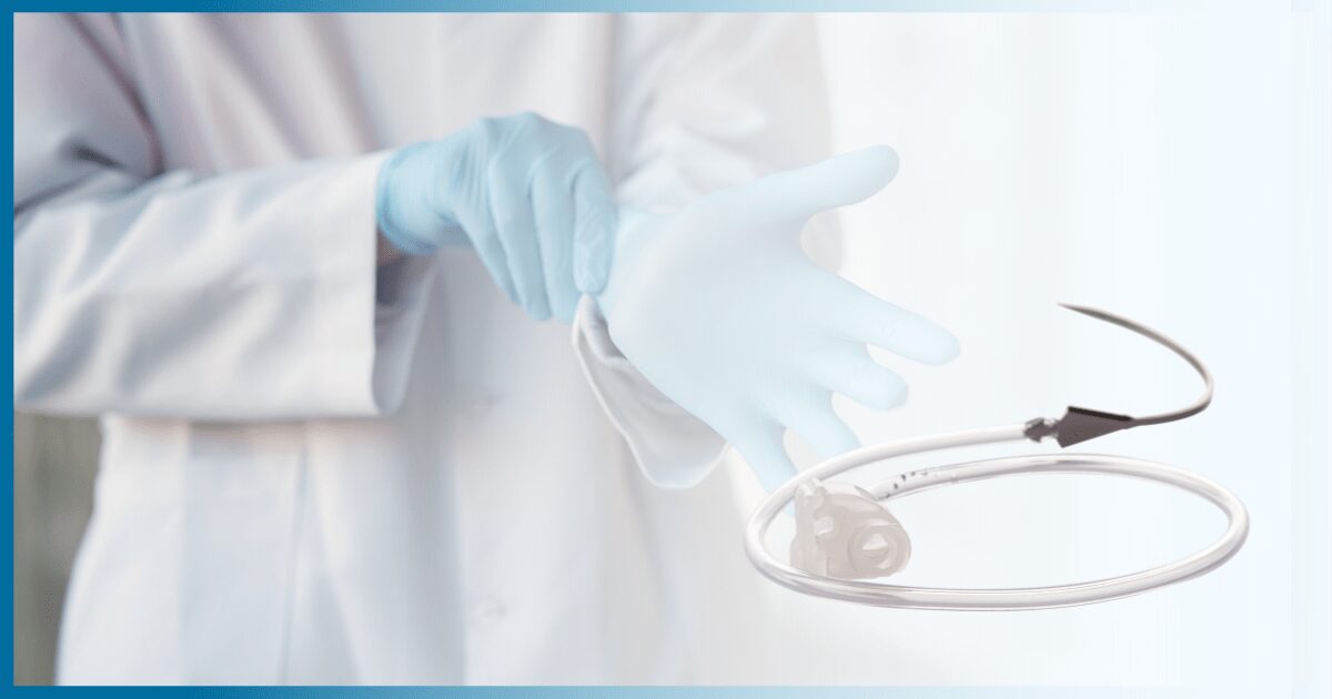 Medical professional putting on blue gloves